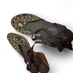 Black and gold leather sandals